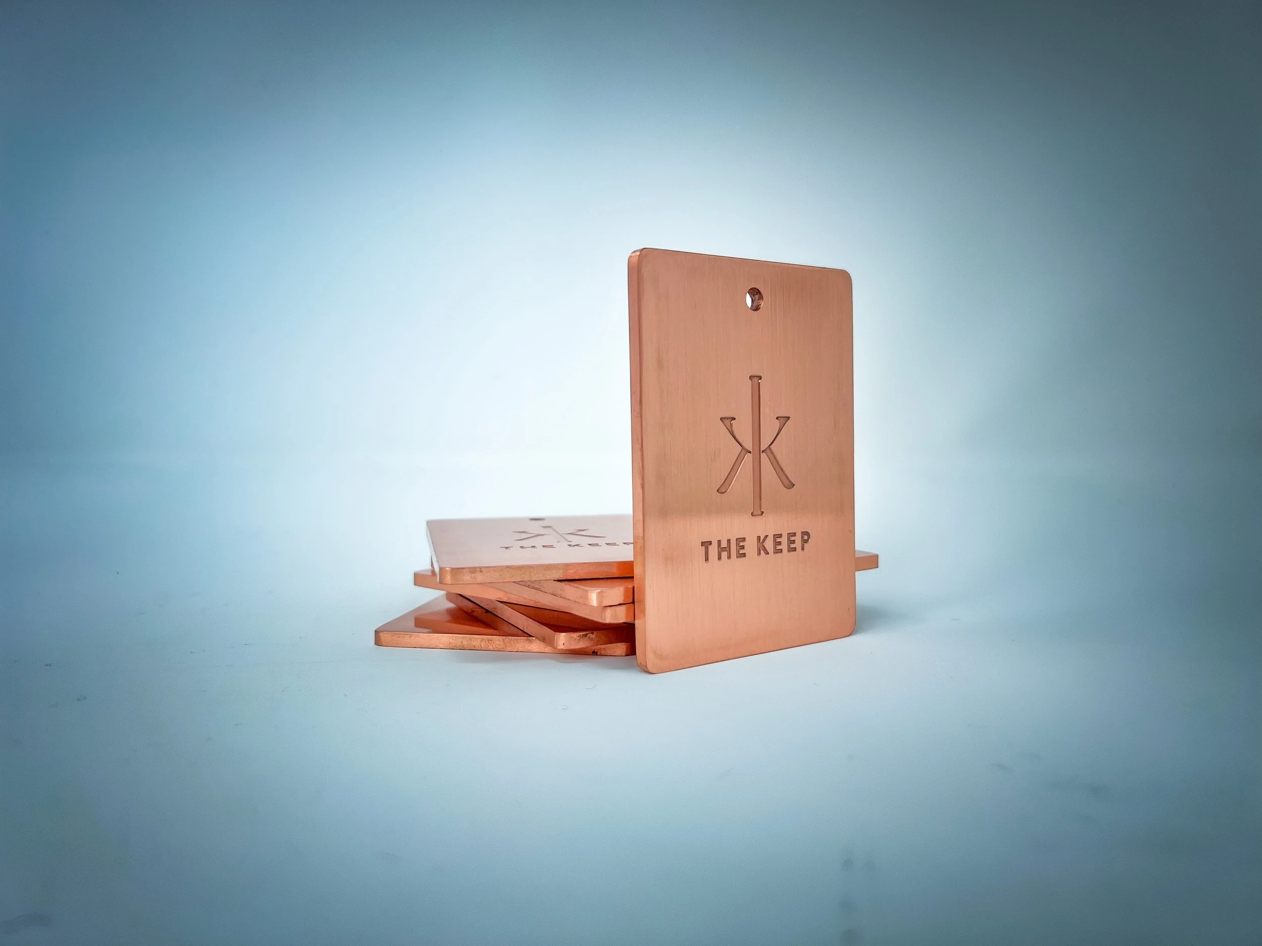 The Keep exclusive 8-ounce copper member bag tag with debossed icon